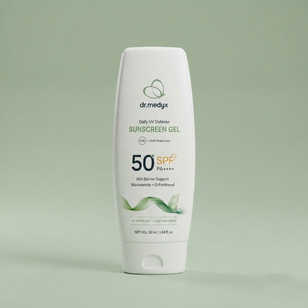 The dr.medyx Daily UV Defense Sunscreen Gel tube on a soft sage studio ground