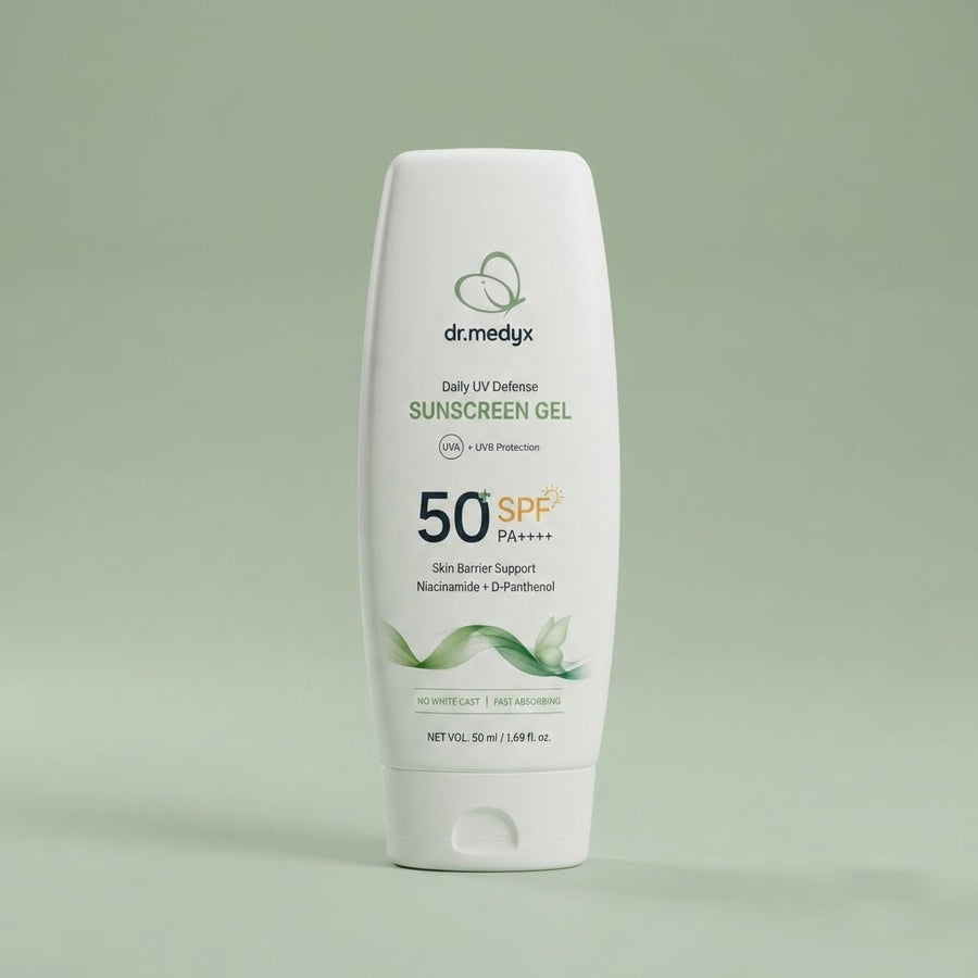 The dr.medyx Daily UV Defense Sunscreen Gel tube on a soft sage studio ground